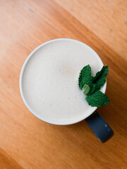 Creamy Latte Topped with Fresh Mint Leaves