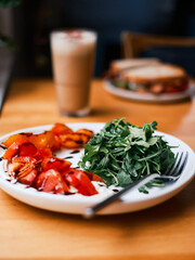 Arugula and Tomato Salad with Balsamic on White Plate