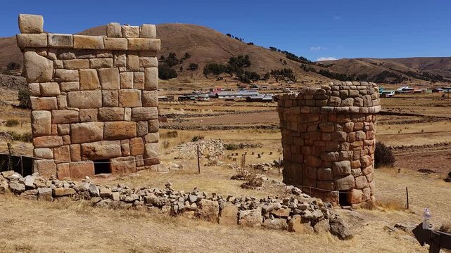 A stunning panoramic view of the ancient stone funerary monuments of Chullpas de Molloco near Acora, Peru, highlighting their historical significance in the Andean landscape.