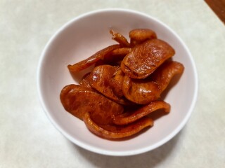 Chinese sausage, Kun Chieng in white bowl serving on gray wood table