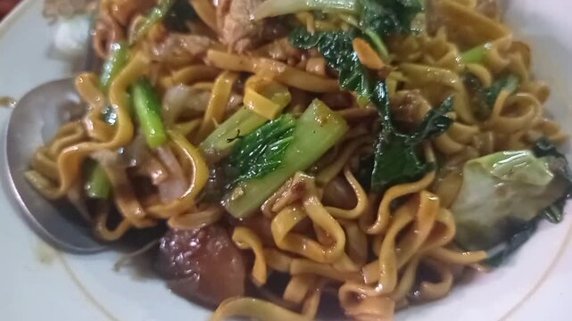 a picture of bakmi malang indonesi street food
