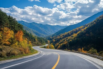Fototapeta premium Winding road through colorful autumn mountains