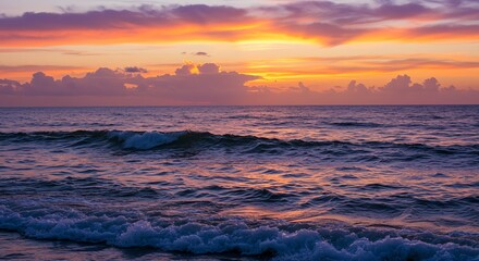 Beautiful Sunset Over Ocean with Colorful Clouds and Gentle Waves