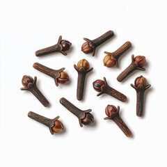 A top-down view of several whole cloves scattered on a clean, white background. The cloves are brown and have a distinctive shape, showcasing their dried flower bud appearance.