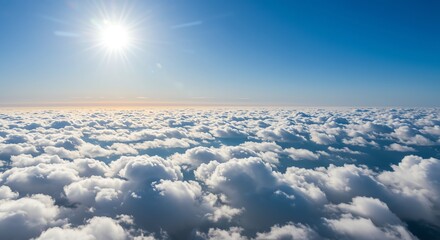 Fototapeta premium Bright Sun Over Cloudscape in Clear Blue Sky Above White Fluffy Clouds