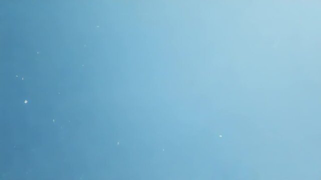 White cloud computing breaking through blue wall emerging from shattered pieces
