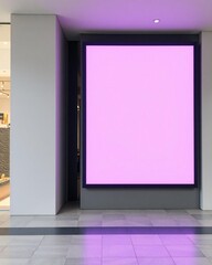 Modern building facade with large illuminated pink digital display screen