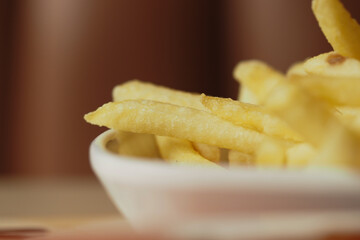 Crispy golden fries served in a white bowl