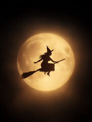 witch flying on broomstick on halloween night