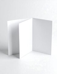 Tri-fold blank white card stock on a white background
