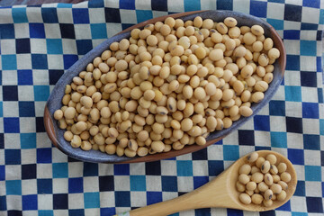 Fresh soybeans in a bowl on checkered cloth