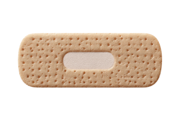Closeup of a beige fabric bandaid with a perforated texture and absorbent pad, isolated on a transparent background