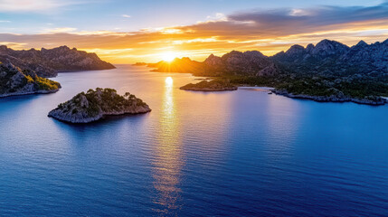 Obraz premium Breathtaking aerial view of twin islands glowing in last rays of sunset over calm waters