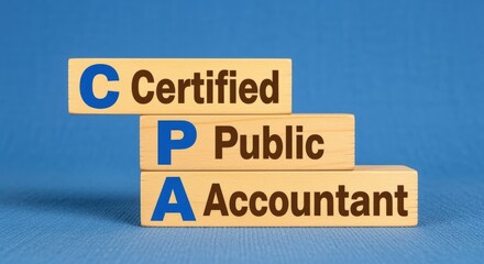 Obraz premium Certified Public Accountant Wooden Blocks Displaying CPA Acronym and Blue Background Promoting Trust and Professionalism