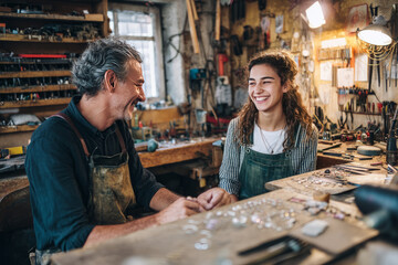Morning in a community workshop with tools and materials A young craftsman is making jewelry and smiling at a customer