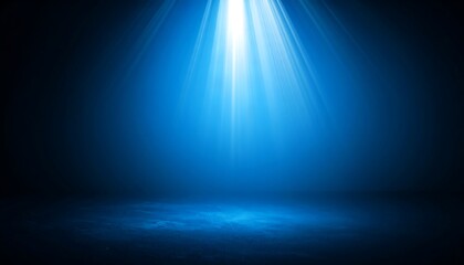Bright blue spotlight shining on a dark, empty stage. Mysterious background with dramatic light rays for a show or presentation.