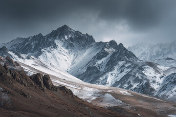 Fototapeta premium A striking view of Heidu Mountain in Qinghai, China, where slate grey, charcoal black, and snowy white tones form a naturally monochromatic scene. 