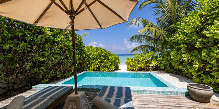 Luxury resort villa with private pool palm trees and sea view Maldives top vacation destination scenic beach villa poolside lounge chairs umbrella perfect summer tropical tourism getaway paradise