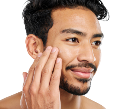 A close-up of a man gently touching his face, highlighting skincare and personal grooming on a dark background.