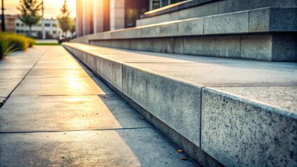 Sunlight Illuminates Modern Stone Steps and Walkway Leading to a Building Entrance at Sunset