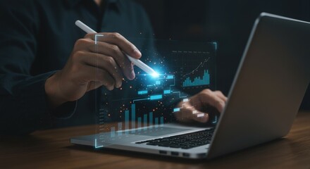 Person analyzing financial data with a stylus and laptop