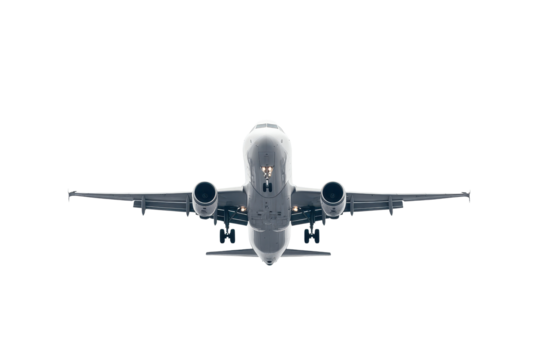 White airplane taking off from an isolated location against overcast sky during day, showcasing its takeoff position with detailed view of wings and engines