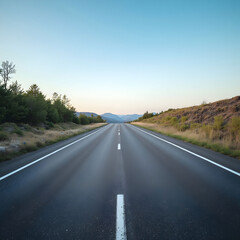 Naklejka premium Vertical shot of an asphalt road under the blue sky