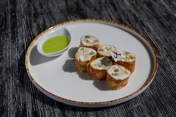 The cook prepares a fruit roll from pancakes. 