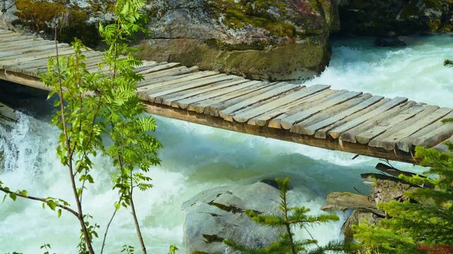 Wooden bridges and raging rivers in the valley