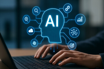 Futuristic AI Technology Concept – Human Hands Typing on Laptop with Glowing Holographic Artificial Intelligence Head and Digital Icons for Automation, Search, Predictive Analysis in Modern Office.