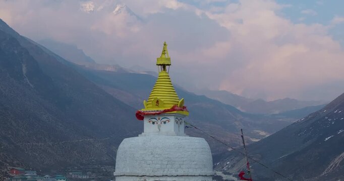 Drone shot of Dingboche Stupa (4400m) with mountain backdrop, cloudy sky, and serene wind &ndash; peaceful spiritual moment in Nepal Himalayas nature