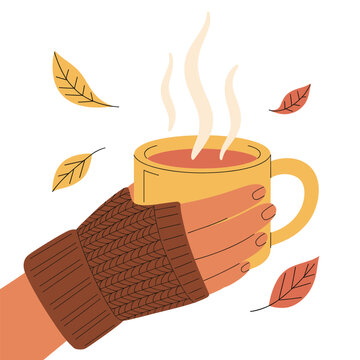 hand holding yellow mug, autumn leaves clip art preview
