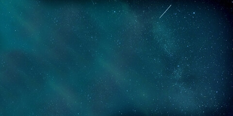 This stunning night sky image showcases a captivating emerald glow illuminating a sea of stars. A...