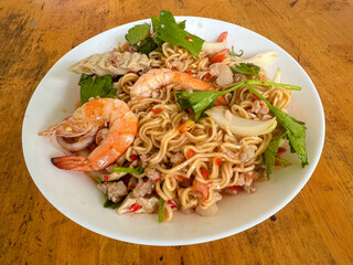 Thai spicy salad with mama noodles, Vietnamese sausage, minced pork and shrimps