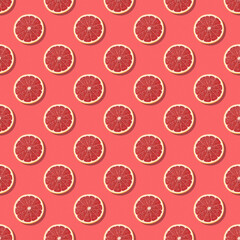 Concept of creative fruits food, candy pattern. Pink citrus food on seamless background. Fresh grapefruit slice on pink background. 