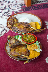 Fried Duck with Green Chili Sambal, captured on August 12, 2025. Crispy fried duck served with spicy green chili sambal, fresh vegetables, and steamed rice on a traditional plate.