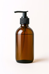 Fototapeta premium Amber glass soap dispenser mockup with black pump top for eco liquid hygiene products, on white background
