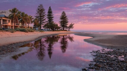 Obraz premium Coastal sunset reflections, calm water, beach houses