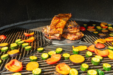 Grilled Pork Ribs And Vegetables On Barbecue. Summer Barbecue Scene With Juicy Pork Ribs And Colorful Grilled Vegetables Outdoor Cooking And Picnic Atmosphere.