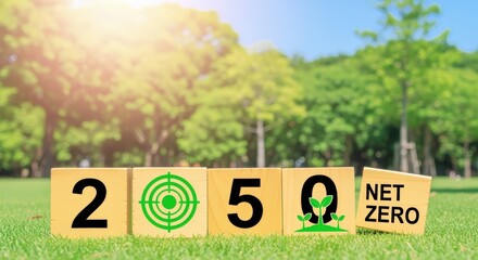 Net Zero 2050 Concept: Wooden Blocks Displaying a Target and Plant Icon on Green Grass, Surrounded by Trees