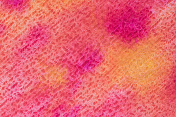 close up of cold press canvas stained with bright watercolor paints