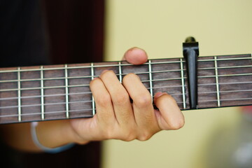close-up shots of hands playing the guitar, showcasing different finger positions and techniques, perfect for music enthusiasts and instructional content