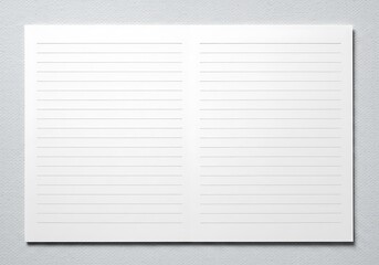 Open lined notebook on a textured light surface, perfect for writing, sketching, or creative planning.
