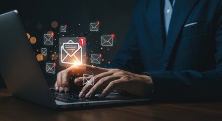 Businessman interacting with digital email and communication icons on laptop