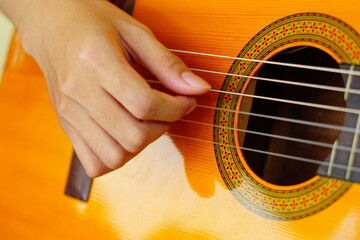 close-up shots of hands playing the guitar, showcasing different finger positions and techniques,...