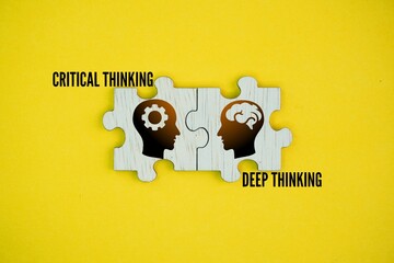 Wooden puzzle with Two things or words: Critical thinking and Deep thinking. related but distinct...