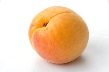 Fresh Ripe Apricot with Reflective Surface Highlighting Bright Colors on White Background

