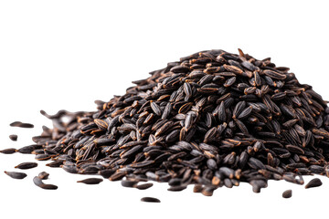Pile of dark, oblong seeds, sharply focused on top, gradually blurring outward on a dark background