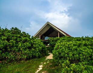 Coastal hut nestled in lush greenery