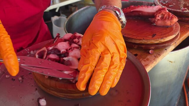 hand cutting galician-style octopus at the fair